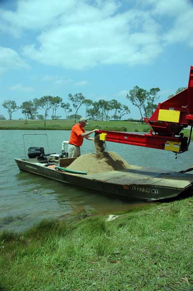 Agricultural limestone can be applied from a flatbottom boat by building a plywood deck on the front. Pontoon boats offer more floatation and can safely carry a heavier load.